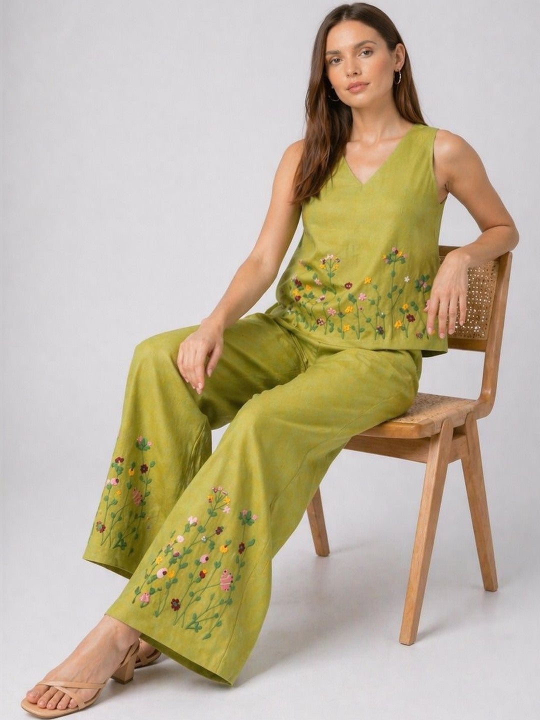 Women’s green embroidered co-ord set with sleeveless top and wide-leg pants from Crazy Needle Online, featuring intricate embroidery details.