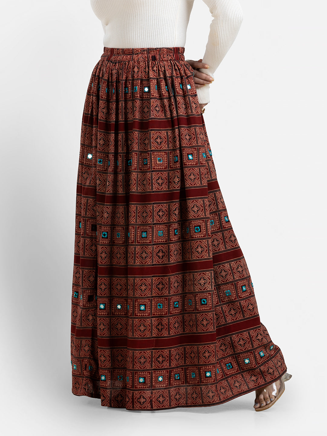 Maroon women's long skirt with traditional Ajrakh print from Crazy Needle Online, featuring intricate patterns and a flowing design.