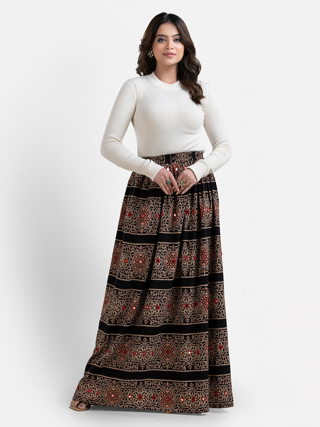 Women’s printed black long skirt from Crazy Needle Online, featuring a flowy design and stylish pattern, perfect for casual or dressy wear.