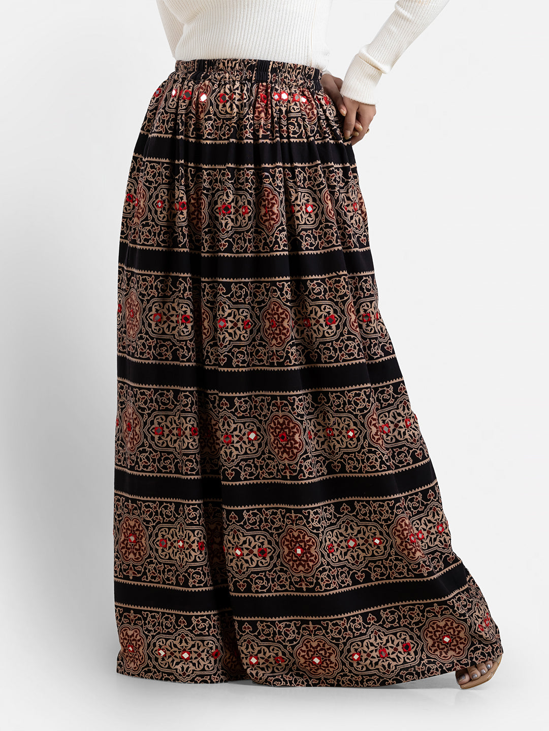 Women's printed black long skirt from Crazy Needle Online, featuring a flowing design and stylish pattern.