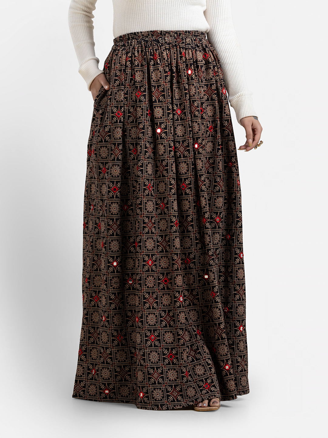 Women's black printed skirt from Crazy Needle Online, featuring stylish pattern and comfortable fit, shown on a model.