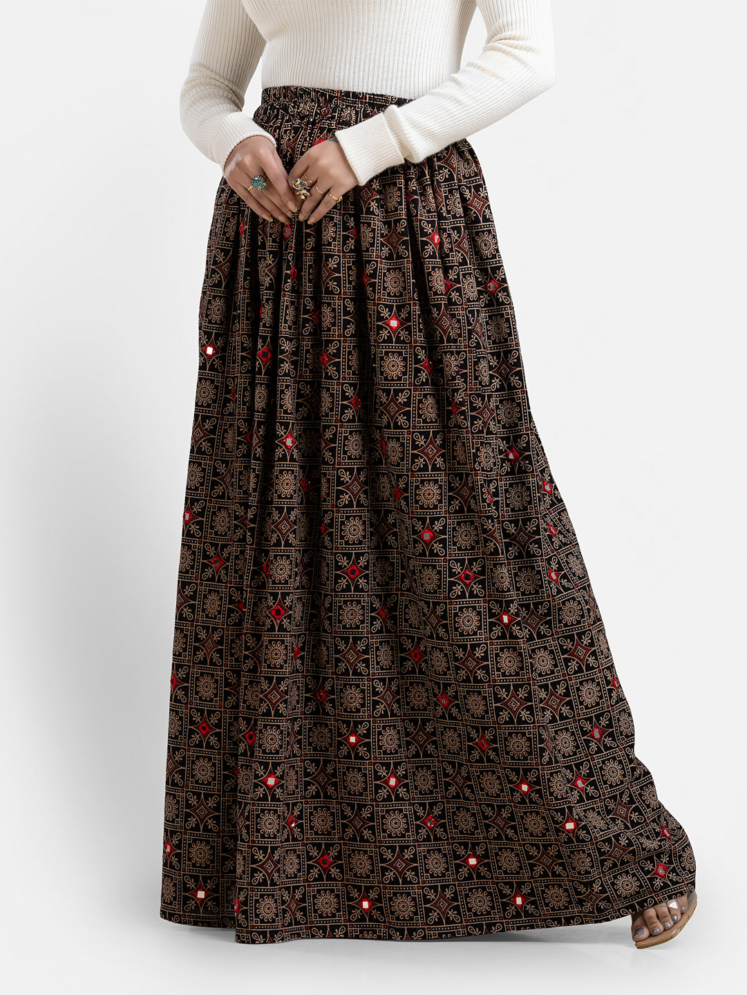 Printed black women's skirt from Crazy Needle Online, showcasing a stylish floral pattern and comfortable fit.