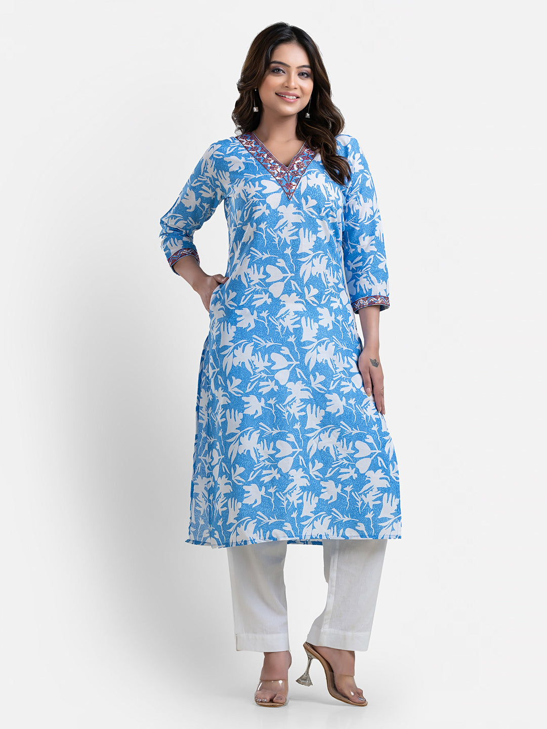 Women’s sky blue printed kurti with V-neck neckline and floral pattern, casual wear from Crazy Needle Online.