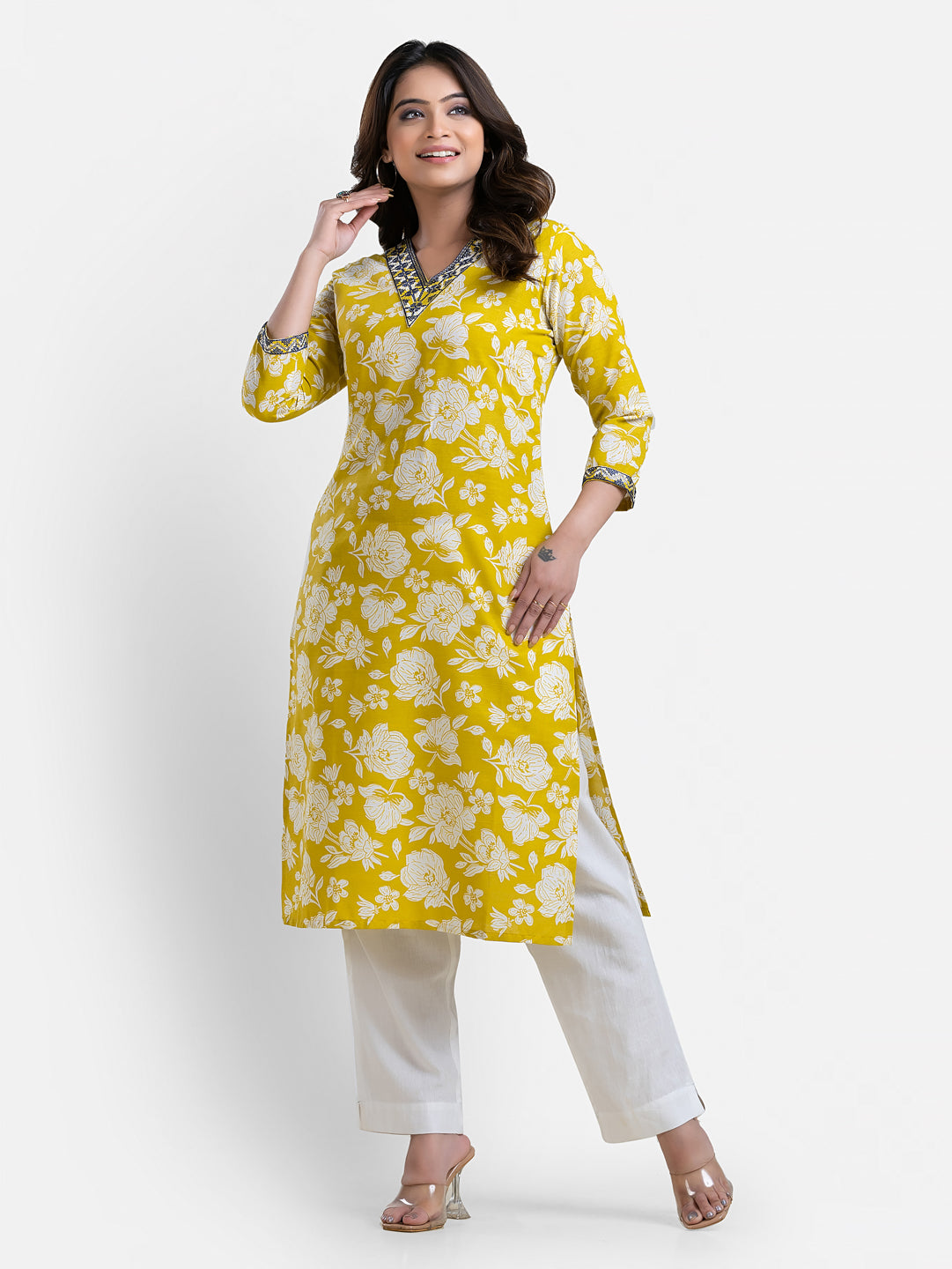 Yellow printed women's kurti with V-neck neckline, casual Indian attire from Crazy Needle Online, shown on a mannequin.