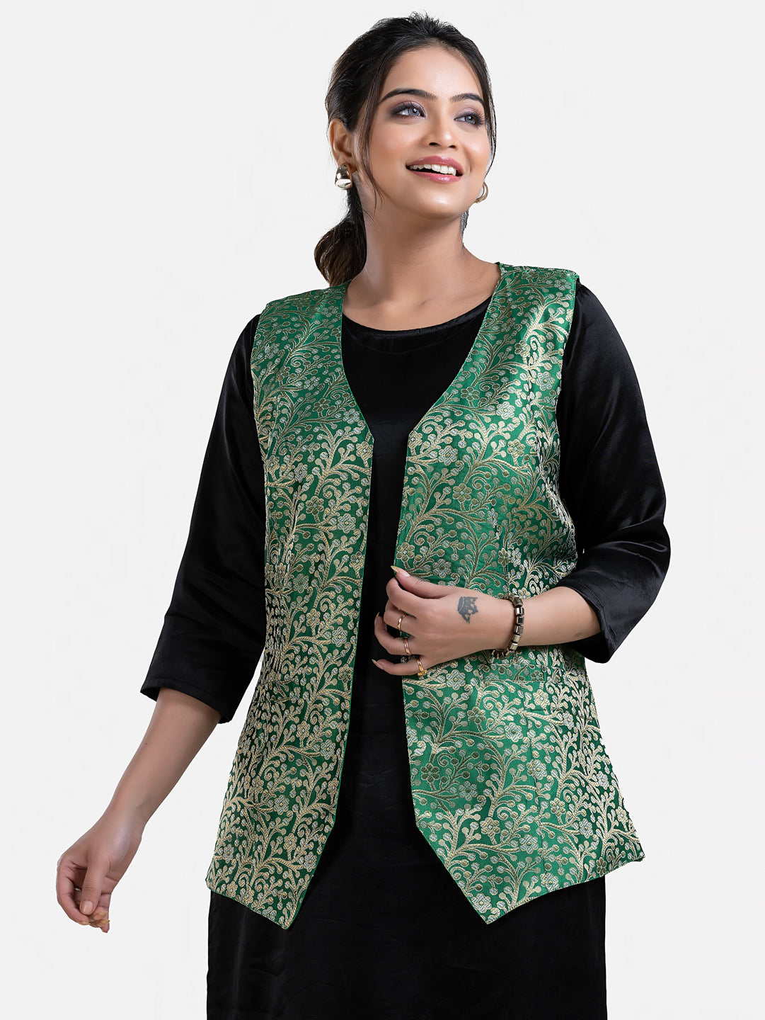 Women's green sleeveless brocade jacket by Crazy Needle Online, showcasing intricate fabric and stylish design.