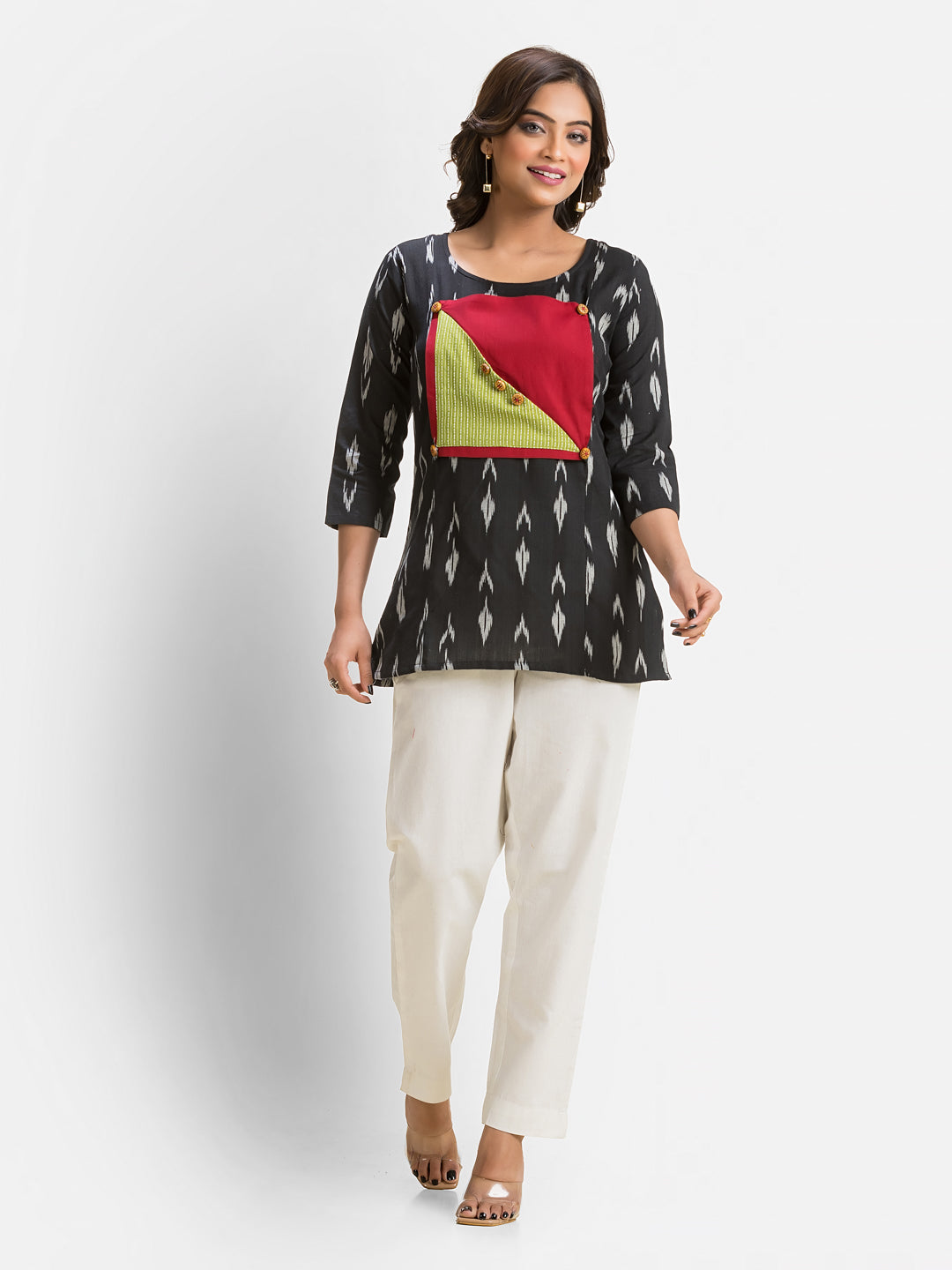 Women's black cotton Ikkat patchwork top with intricate design, stylish and comfortable for casual wear.