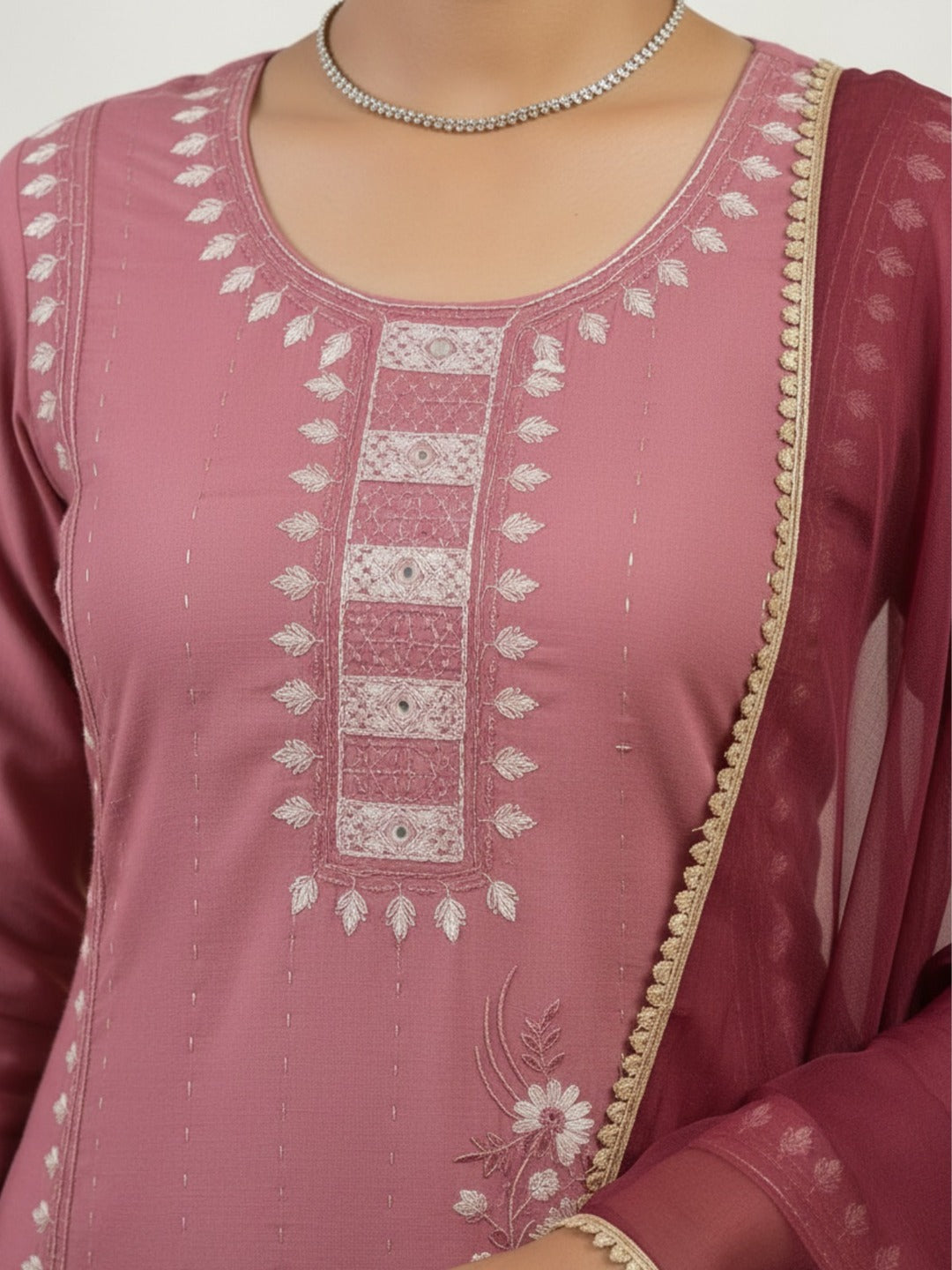 Three images of a women's peach handwork kurti pant set with dupatta by Crazy Needle Online, showcasing intricate embroidery and traditional design.