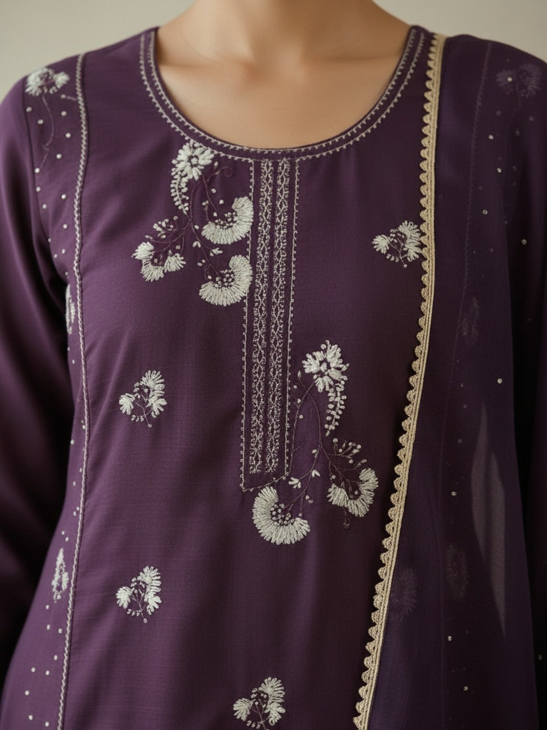 Women's purple kurti pant set with dupatta, featuring thread work, shown from three angles in a Crazy Needle Online image.