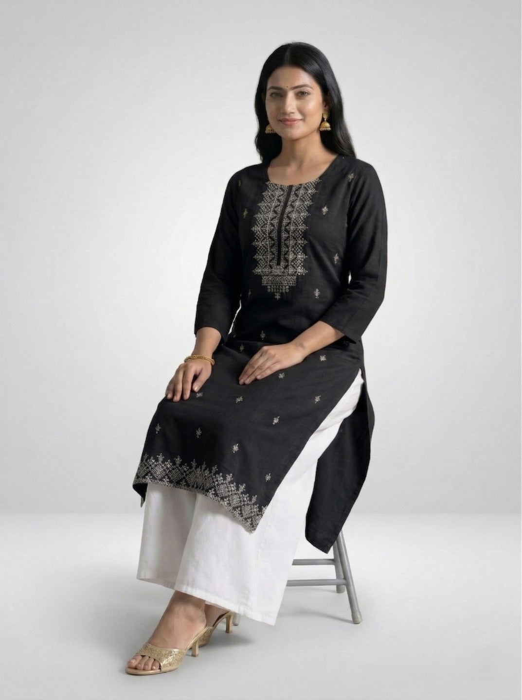Black women's handwork kurti with intricate embroidery, casual fit, by Crazy Needle Online, displayed on a hanger.