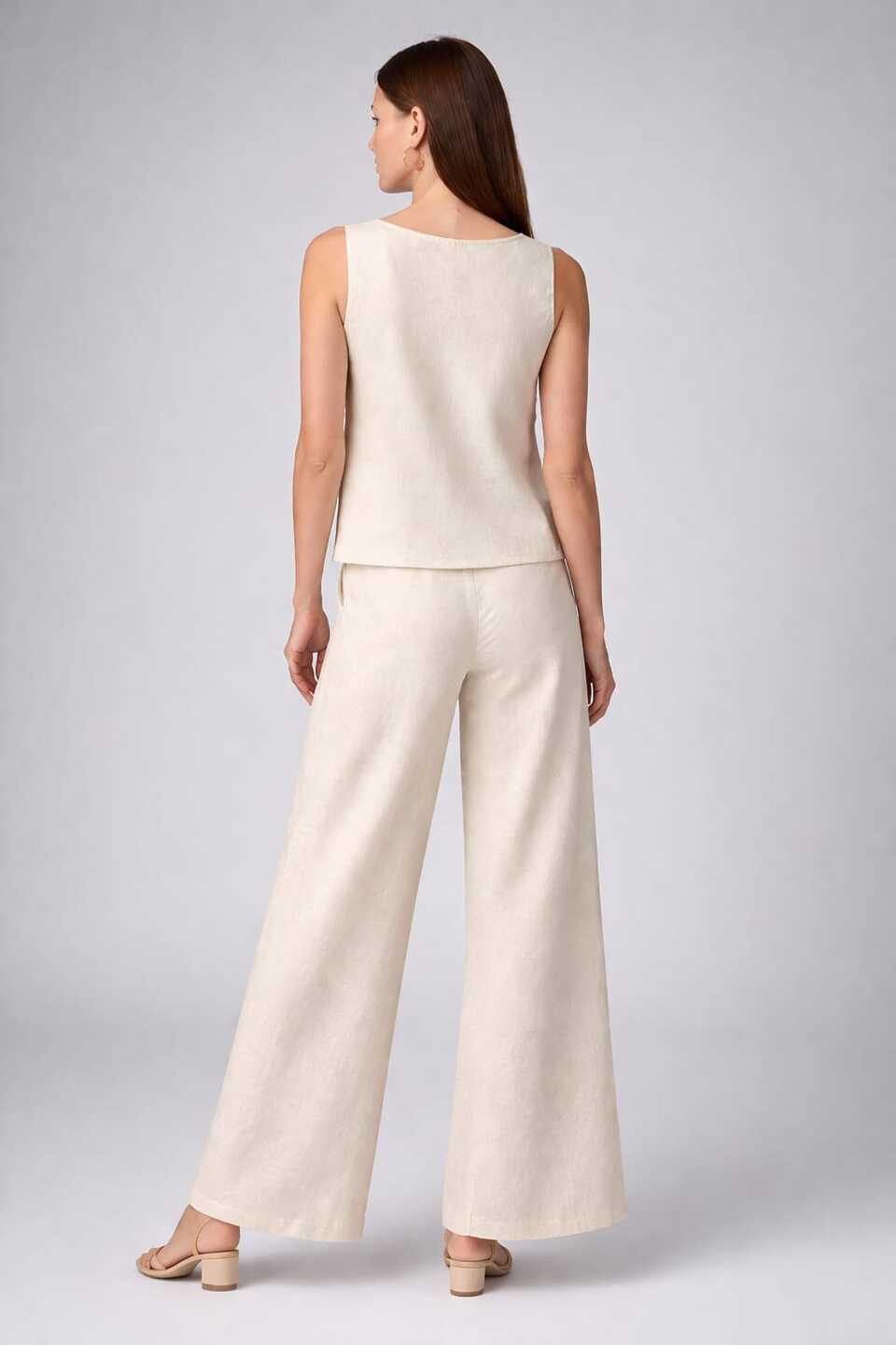 Women’s white embroidered co-ord set with sleeveless top and wide-leg pants from Crazy Needle Online, styled for casual wear.