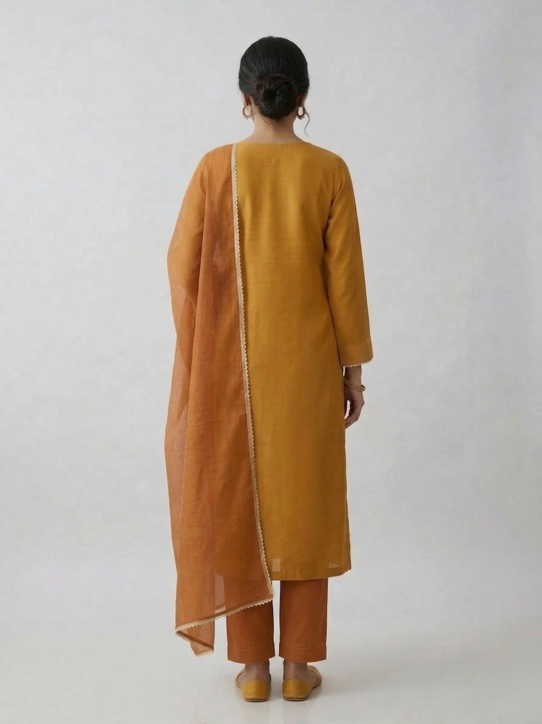 Yellow women's kurti and pant set with dupatta from Crazy Needle Online, featuring thread work and traditional design.