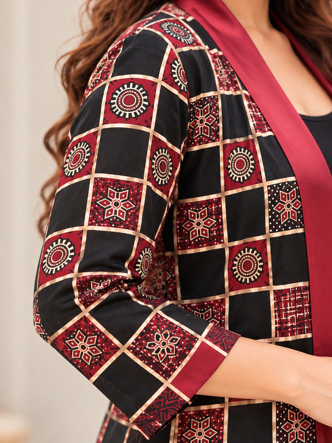 Women’s red geometric printed longline shrug by Crazy Needle Online, showcasing a stylish and vibrant layered garment.