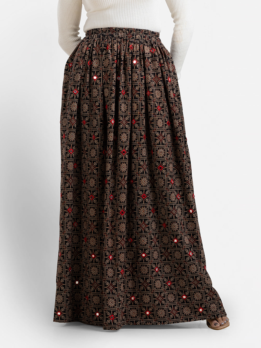 Women's printed black skirt by Crazy Needle Online, showcasing stylish fabric and pattern detail.