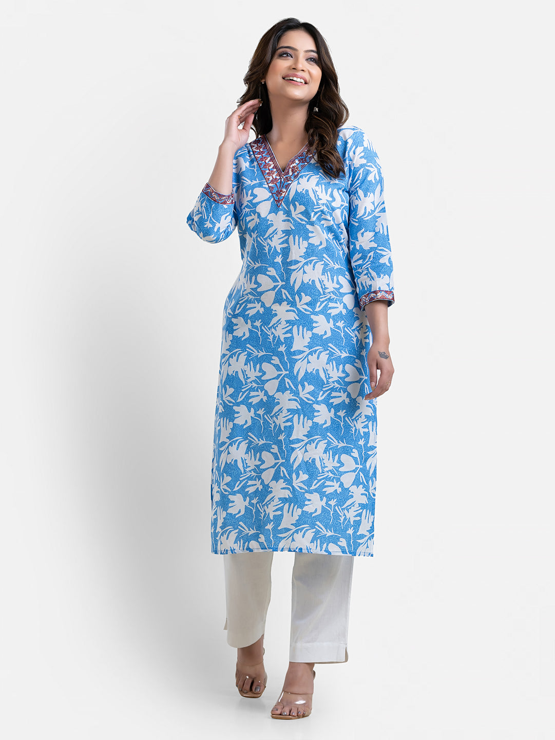 Sky blue printed women's kurti with V-neck design by Crazy Needle Online, showcasing the detailed neckline and vibrant pattern.