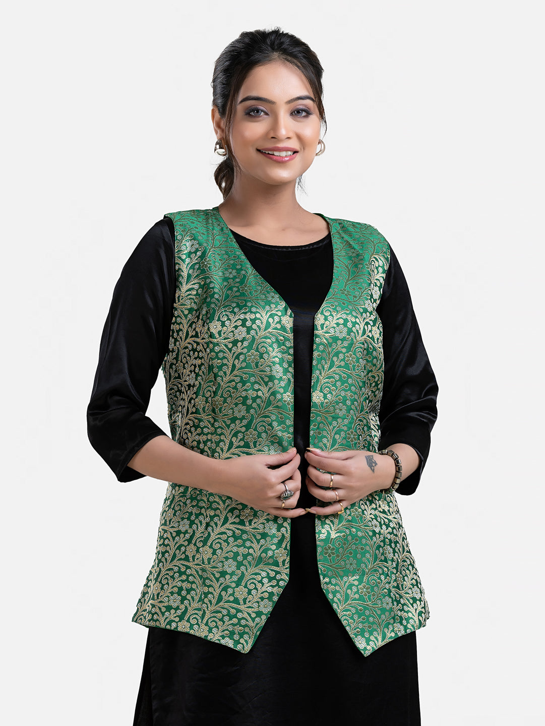 Women's green sleeveless brocade jacket by Crazy Needle Online, featuring intricate fabric and stylish design.