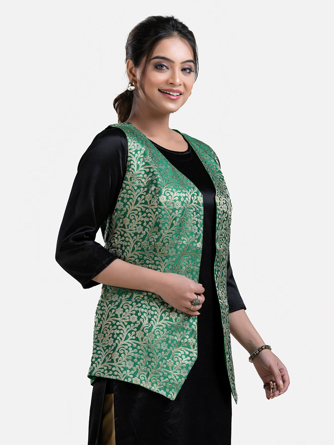 Green sleeveless brocade jacket for women, stylish and elegant, from Crazy Needle Online, shown on a hanger.
