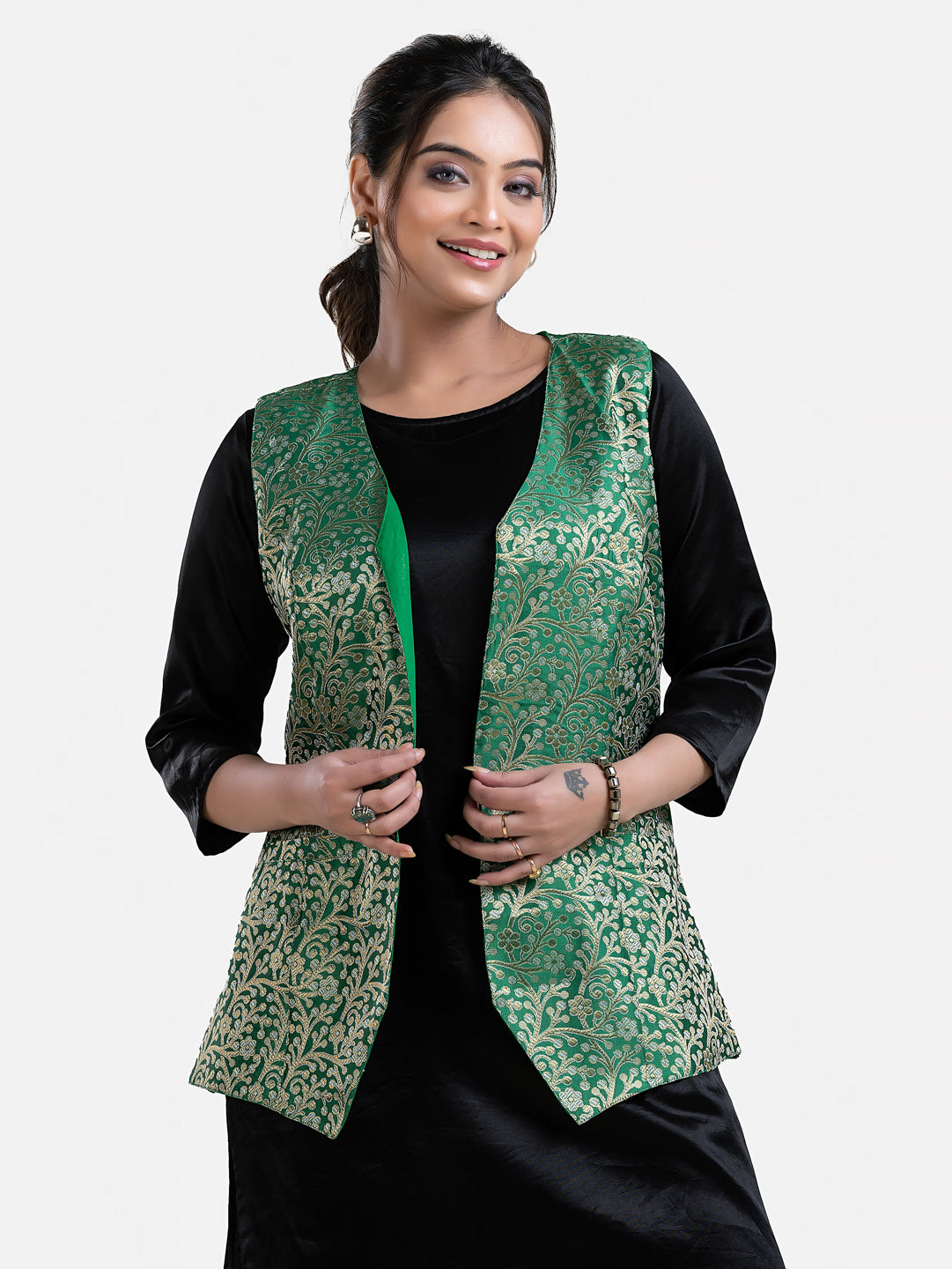 Green sleeveless brocade jacket for women, stylish design by Crazy Needle Online, featuring intricate fabric details.