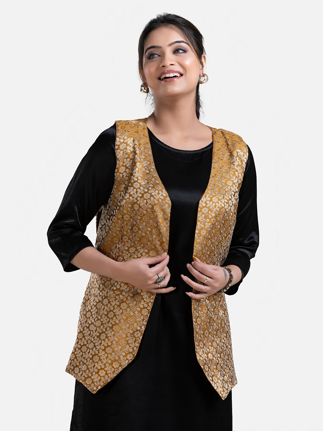 Women's yellow sleeveless brocade jacket by Crazy Needle Online, detailed fabric and stylish design, shown on a hanger.