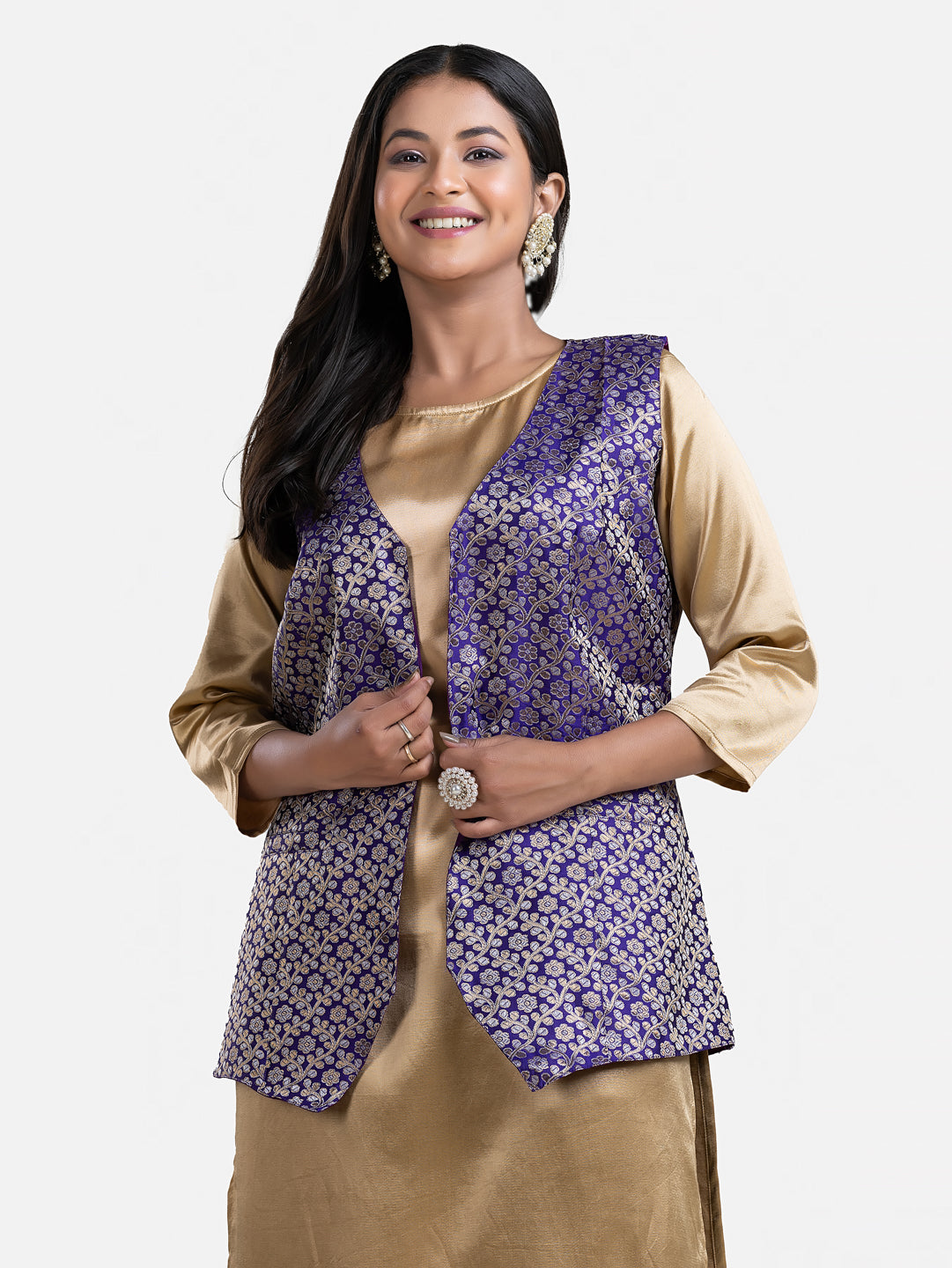 Women's blue sleeveless brocade jacket by Crazy Needle Online, featuring intricate fabric and stylish design.
