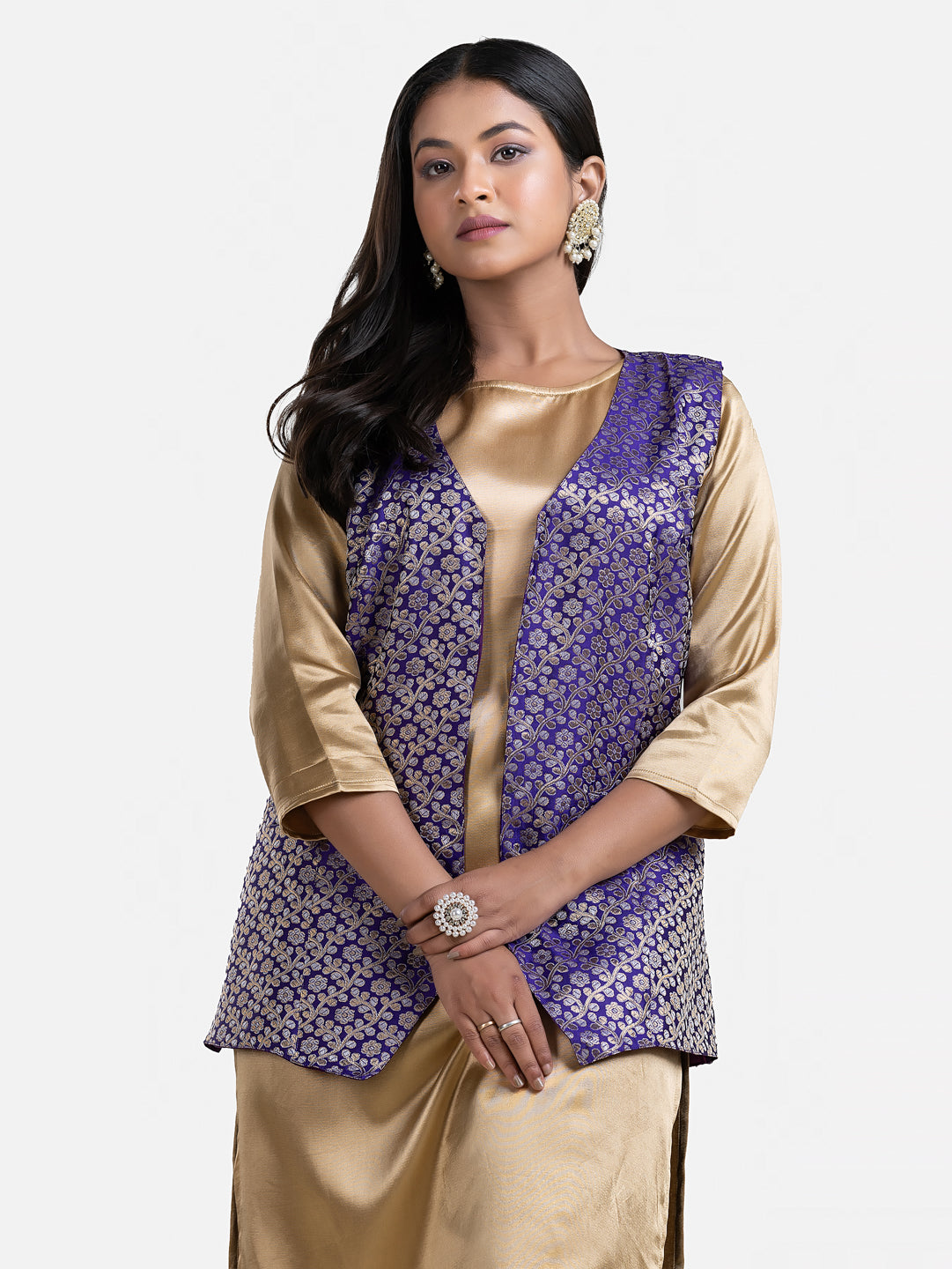 Women's blue sleeveless brocade jacket by Crazy Needle Online, detailed fabric with elegant design and tailored fit.