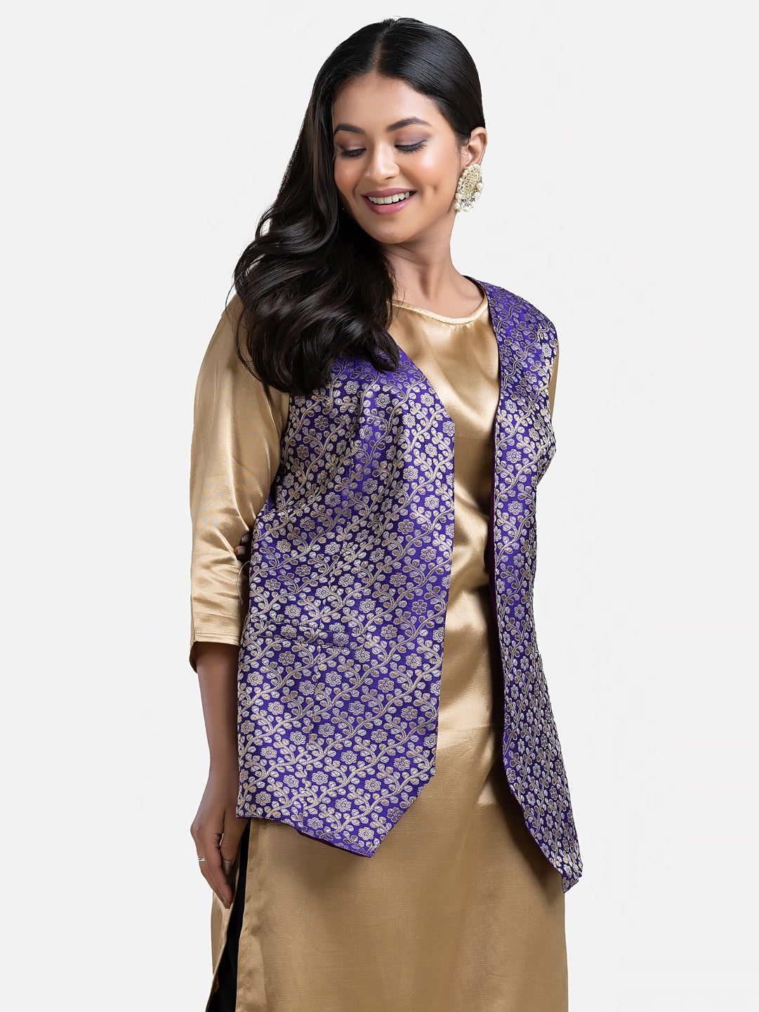 Women's blue sleeveless brocade jacket from Crazy Needle Online, featuring intricate fabric details and a stylish fit.