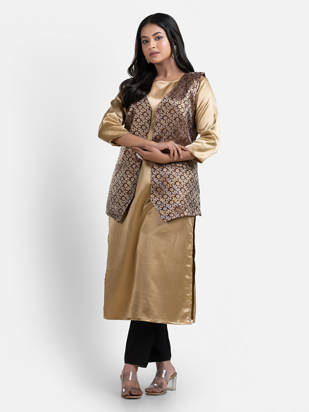 Women's brown sleeveless brocade jacket by Crazy Needle Online, featuring intricate fabric design and tailored fit.