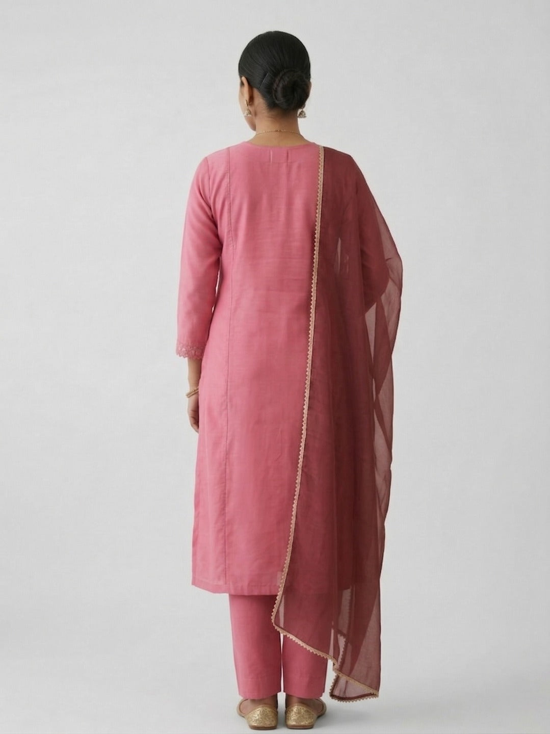 Women’s peach handwork kurti and pant set with dupatta, featuring intricate embroidery and traditional style, by Crazy Needle Online.