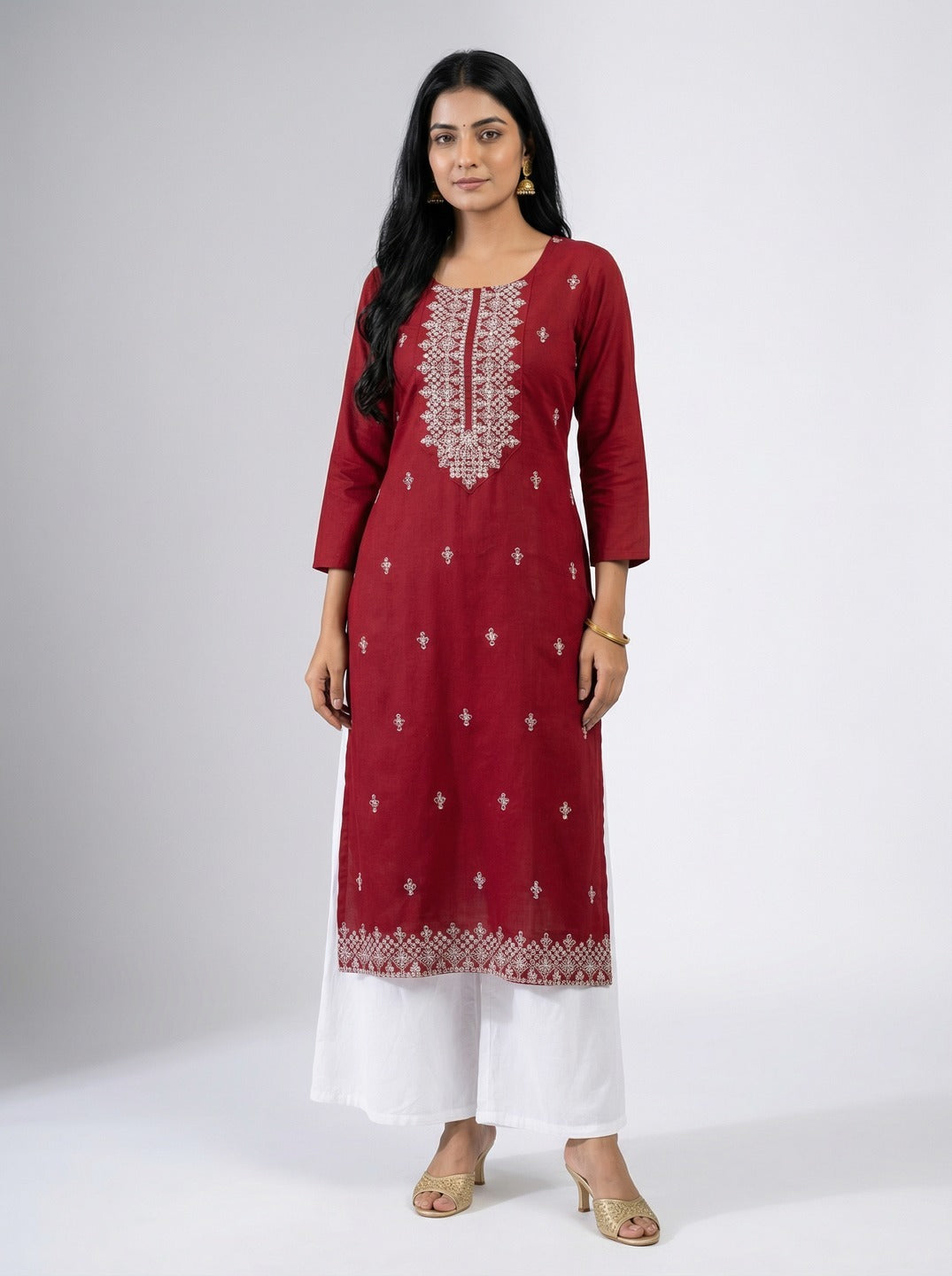 Maroon women's hand work kurti with intricate embroidery, stylish kurta from Crazy Needle Online displayed on a model.