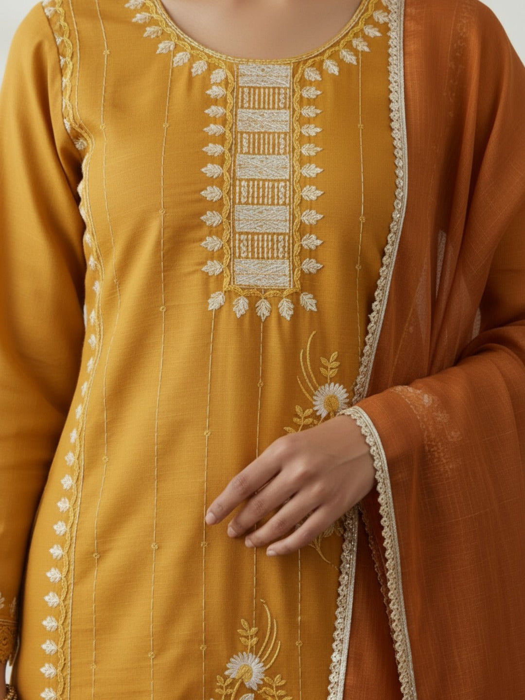 Women's yellow handwork kurti and pant set with dupatta, featuring intricate embroidery, from Crazy Needle Online.