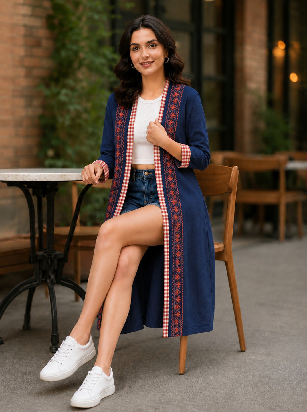 Women's navy long cotton shrug from Crazy Needle Online, showing the relaxed fit and soft fabric draped over the shoulders.